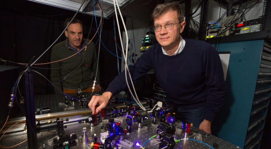 Harvard researchers Mikhail Lukin (foreground) and Markus Greiner with neutral atoms systems as quantum computers.