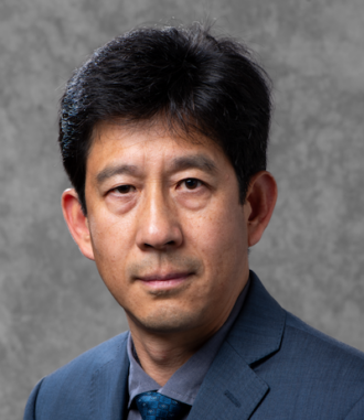 Gao Liu, a person with short black hear wearing a navy blazer, smiling for a portrait.