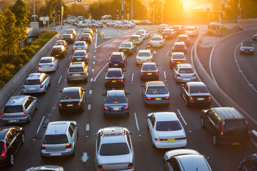 A busy highway at sunset.